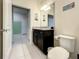 Bathroom with granite vanity and toilet at 826 Paradise Dr, Davenport, FL 33897