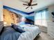 Bedroom featuring beach mural and double bed at 826 Paradise Dr, Davenport, FL 33897