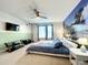 Bedroom with a king-size bed, TV, and ocean view at 826 Paradise Dr, Davenport, FL 33897