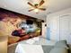 Bedroom with waterfall mural and comfortable bedding at 826 Paradise Dr, Davenport, FL 33897