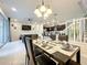 Bright dining room featuring a spacious table and modern chandelier at 826 Paradise Dr, Davenport, FL 33897