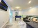 Spacious game room with a comfortable sectional sofa, a foosball table, and modern LED lighting at 826 Paradise Dr, Davenport, FL 33897