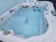 Relaxing hot tub offers a soothing escape with its spacious design and sparkling, refreshing water at 826 Paradise Dr, Davenport, FL 33897