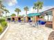 Community patio with tables, umbrellas, and comfortable seating at 826 Paradise Dr, Davenport, FL 33897