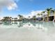 Large resort-style pool with surrounding lounge area at 826 Paradise Dr, Davenport, FL 33897