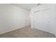 Bedroom featuring neutral carpeting, white walls and a double door closet at 1124 Griffon Ave, Lake Alfred, FL 33850
