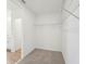 Walk-in closet with carpeted floor and wire shelving at 1124 Griffon Ave, Lake Alfred, FL 33850