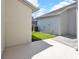 Backyard with an air conditioning system and a small plot of grass at 14480 Chinese Elm Dr, Orlando, FL 32828