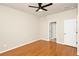 Neutral bedroom with a ceiling fan and hardwood floors at 14480 Chinese Elm Dr, Orlando, FL 32828