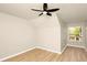 Bedroom featuring wood floors, ceiling fan, natural light, and neutral paint at 14480 Chinese Elm Dr, Orlando, FL 32828