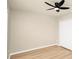 Bedroom featuring a ceiling fan, neutral walls, wood-look flooring and a closet at 14480 Chinese Elm Dr, Orlando, FL 32828