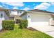 Beautiful townhouse with a two car garage and well manicured landscaping at 14480 Chinese Elm Dr, Orlando, FL 32828