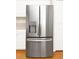 Stainless steel refrigerator with water dispenser complementing white cabinets in a modern kitchen at 14480 Chinese Elm Dr, Orlando, FL 32828