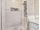 Walk-in shower with pebble floor and tile surround at 14480 Chinese Elm Dr, Orlando, FL 32828