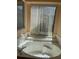 Bathroom featuring a white tiled whirlpool tub and a view to the outside at 2355 Abalone Blvd, Orlando, FL 32833