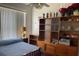 Simple bedroom with neutral tones, wood furniture, and ceiling fan at 2355 Abalone Blvd, Orlando, FL 32833