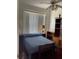 Bedroom with simple furniture and minimal natural light at 2355 Abalone Blvd, Orlando, FL 32833