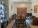 Dining room with traditional wood furniture, chandelier, and area rug at 2355 Abalone Blvd, Orlando, FL 32833