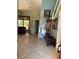 Inviting foyer with tiled floor, stairway, and view to the living room at 2355 Abalone Blvd, Orlando, FL 32833