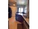 Eat-in kitchen featuring granite countertops, tile floors, and stainless steel appliances at 2355 Abalone Blvd, Orlando, FL 32833