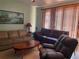 Cozy living room featuring two couches, an area rug, and a light fixture at 2355 Abalone Blvd, Orlando, FL 32833