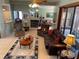 Inviting living room with neutral walls, tile floors, an area rug, and a corner fireplace at 2355 Abalone Blvd, Orlando, FL 32833