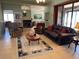 Spacious living room with tile floors, neutral walls, ceiling fan, and view of the dining room at 2355 Abalone Blvd, Orlando, FL 32833
