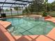 Inviting screened pool with adjacent spa, showcasing a spacious deck for outdoor relaxation at 2355 Abalone Blvd, Orlando, FL 32833