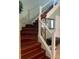 Stairway with dark wood treads and white railing at 2355 Abalone Blvd, Orlando, FL 32833