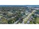 Aerial view of a residential area near a body of water, showing various houses and green spaces at 5533 Satel Dr, Orlando, FL 32810