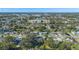 Aerial perspective of a suburban neighborhood, displaying houses and surrounding landscape at 5533 Satel Dr, Orlando, FL 32810