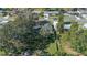 Aerial view of house and surrounding property, showing ample yard space at 5533 Satel Dr, Orlando, FL 32810