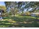 Large backyard, spacious grassy area, and shed at 5533 Satel Dr, Orlando, FL 32810