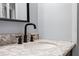 Bathroom with a vanity and marble countertop at 5533 Satel Dr, Orlando, FL 32810