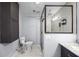 Bathroom with shower, toilet and dark vanity at 5533 Satel Dr, Orlando, FL 32810