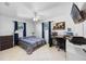 Bedroom with a workspace and striped bedding at 5533 Satel Dr, Orlando, FL 32810
