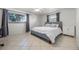 Main bedroom with gray headboard and plenty of natural light at 5533 Satel Dr, Orlando, FL 32810