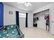 bedroom with gray crib and ample closet space at 5533 Satel Dr, Orlando, FL 32810