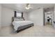 Bright bedroom with a king-size bed and ensuite bathroom access at 5533 Satel Dr, Orlando, FL 32810