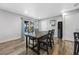 Dining area with hardwood floors and sliding glass doors to patio at 5533 Satel Dr, Orlando, FL 32810