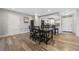 Dining area with hardwood floors and kitchen access at 5533 Satel Dr, Orlando, FL 32810