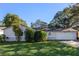 Ranch-style home featuring a spacious yard and attached garage at 5533 Satel Dr, Orlando, FL 32810