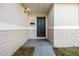 Black front door entry with a welcome mat at 5533 Satel Dr, Orlando, FL 32810