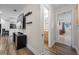 Hallway view with wood floors and access to bathroom and bedroom at 5533 Satel Dr, Orlando, FL 32810