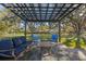 Relaxing patio area with pergola and seating at 5533 Satel Dr, Orlando, FL 32810