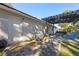 Side yard with patio, AC unit, and access to backyard at 5533 Satel Dr, Orlando, FL 32810