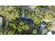 An aerial view showcases a house with a newly constructed roof amidst lush greenery and landscaping at 632 Oakhurst St, Altamonte Springs, FL 32701
