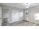 This bedroom features hardwood floors, neutral walls, a closet, and a window offering natural light at 632 Oakhurst St, Altamonte Springs, FL 32701