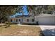 An inviting home featuring a well-kept lawn, a two-car garage, and a serene neighborhood setting at 632 Oakhurst St, Altamonte Springs, FL 32701