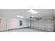 Spacious two-car garage with white walls, a window, and a door leading to the main house at 632 Oakhurst St, Altamonte Springs, FL 32701